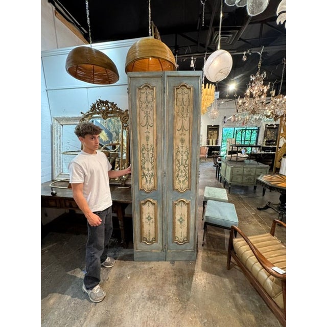This product is a pair of Italian painted doors, perfect for adding a touch of elegance to any living room or bedroom....