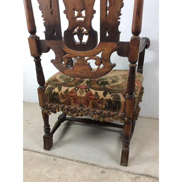 This rare 17th century Charles II high back carved oak armchair features solid wood construction, beautifully carved arms,...