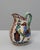 20th Century German Ceramic Vase. This vividly hand-painted ceramic pitcher features a whimsical design with colorful...