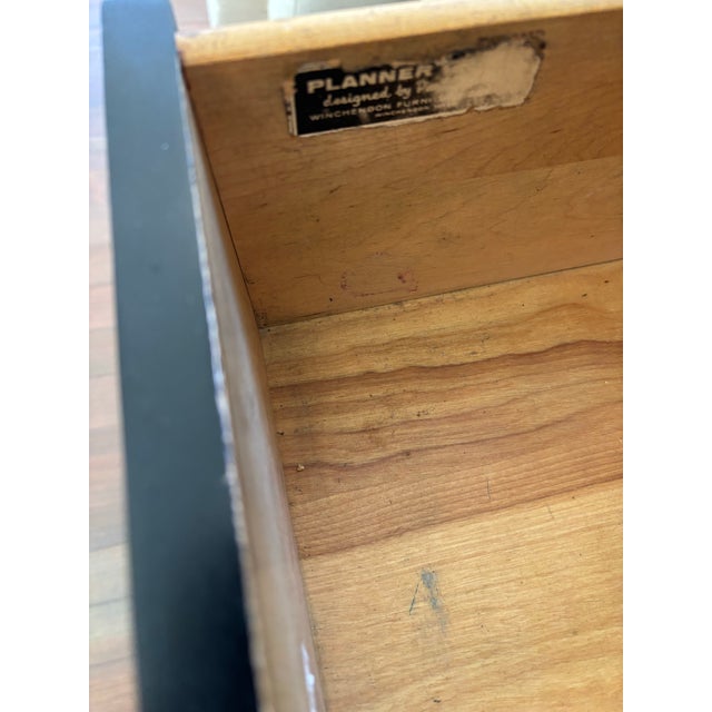 Mid-Century Modern maple desk in blonde wood with 2 black drawers and brass pulls. Sourced in LA on 3rd street West...