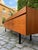 An architectural heavyweight: This imposing XXL sideboard, crafted from exquisite teak, impresses with its substantial...