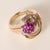 This is a vintage ruby & diamond cluster floral ring Circa 1960 This ring features a vibrant ruby cluster arranged in a...