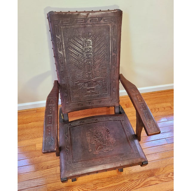 Vintage Peruvian Hand Tooled Leather Folding Chairs With Incan Relief Chairish Beautiful folding chair in solid meranti, backrest and seat in brown saddle leather embossed with inca patterns.