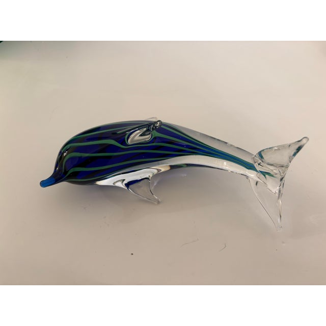 This vintage dolphin is a Sommerso Murano technique style hand blown glass sculpture which has three distint colors; blue,...