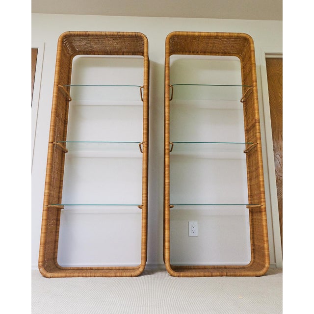 This pair of 1960's French rattan and glass étagères are in wonderful condition. These are widely attributed to Louis...