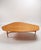 An exclusive and elegant coffee table in extra length, an original 1st-class vintage object from the 1950s, is offered...