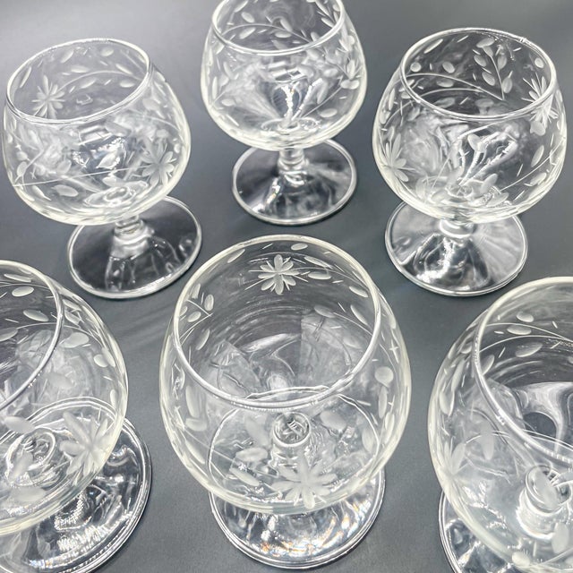 Set of 6 vintage etched cordial glasses featuring a delicate floral and vine pattern. Each glass has a rounded snifter-...