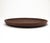 This flat, round wooden bowl dates back to the 1960s and is crafted in the typical Mid Century style. The bowl is made of...