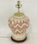 This striking vintage ceramic table lamp features exquisite hand-painted tribal-style patterns, adorned with delicate...