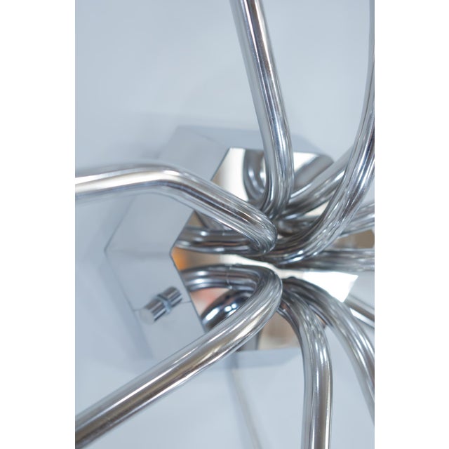 The Anemone lamp by Vincent Decat is designed to embody the diffused glow and perpetual motion of sea anemones. Inspired...