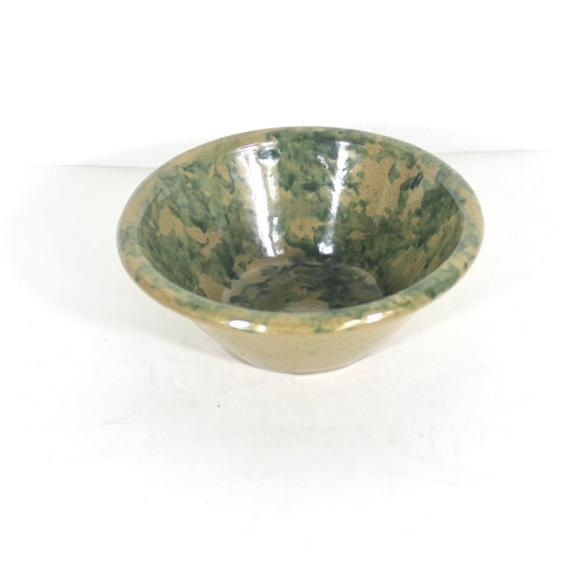Vintage pottery bowl with a green sponge finish on the interior. This is primitive and rustic. There are some spots where...