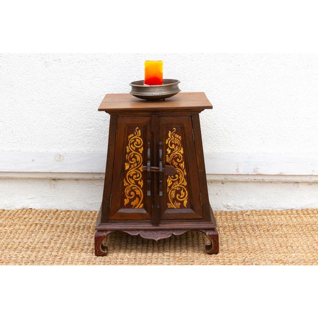 Full of narrative charm and rhythmic color, this small charming cabinet is a 19th-century Thai cabinet handcrafted from...