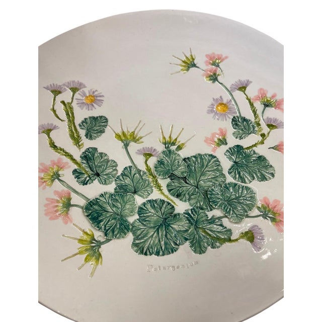 This vintage ceramic platter translates classic botanical illustration into a tactile, three-dimensional centerpiece....