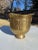 Beautiful hammered brass ornate urn with circular side details. Wide mouth and pedestal base, this could be used as a...