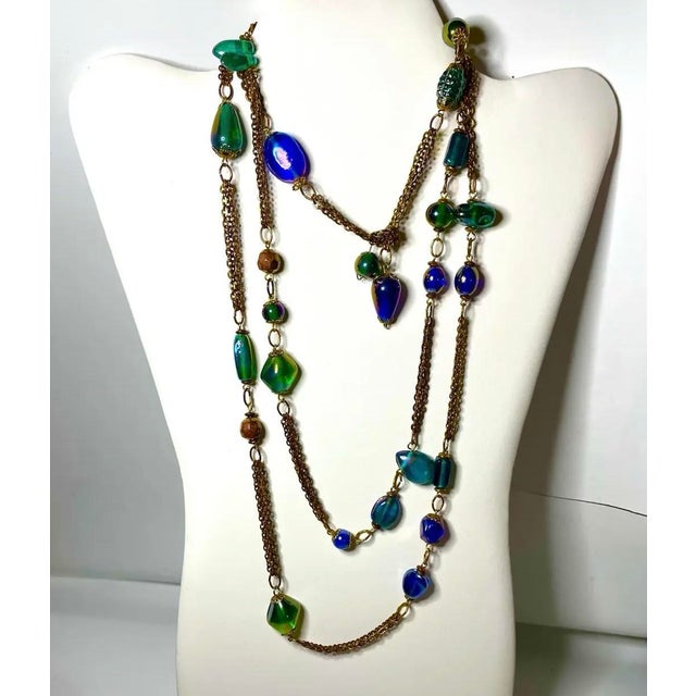 An exceptional mid-century 57-inch lariat necklace featuring an eclectic collection of attributed Venetian/Murano art-...