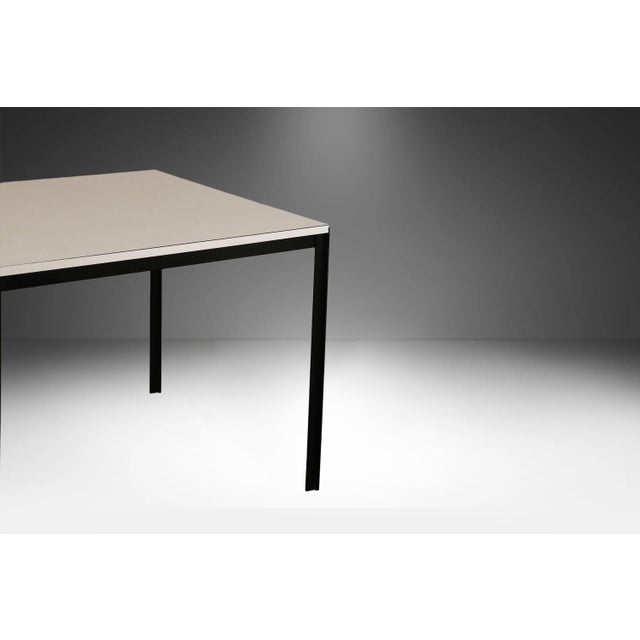 Elevate your space with this authentic Mid-Century Modern "T-Angle" square dining and work table, designed by the...