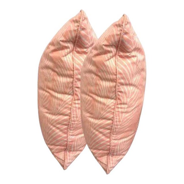 Elevate your space with this elegant blush pink throw pillow, featuring a subtle tropical leaf print in soft white. The...