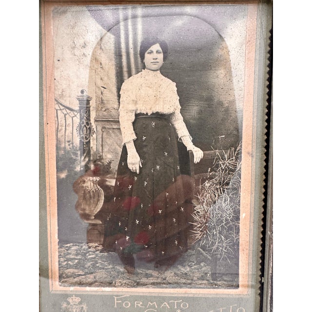 An atmospheric early 1900s Italian “Formato Gabinetto” cabinet card portrait presented in an ornate decorative frame. The...