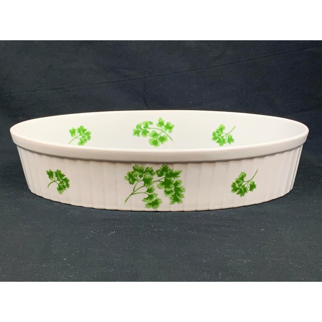 Lovely vintage casserole dish. Features a ridged side design with parsley details. Perfect for serving and cooking in....