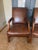 Beautiful pair of Ralph Lauren for Henredon executive/library chairs, crafted in rich brown full-grain leather with...