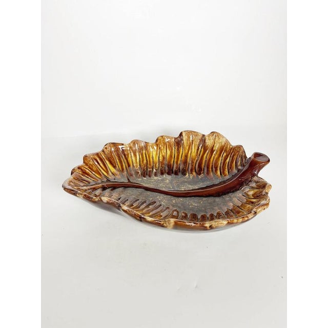 Decorative ceramic catchall made in Vallauris, France, circa 1960s. Designed in the form of a large stylized leaf, the...