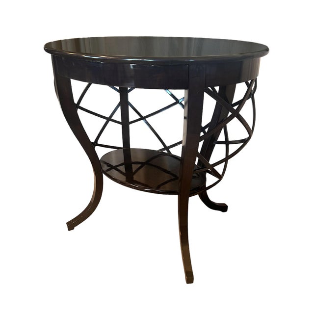 A bespoke L. Rossi side table, from Rossi Antiques in San Francisco, CA. Bent wood strips arranged in an open basketweave...