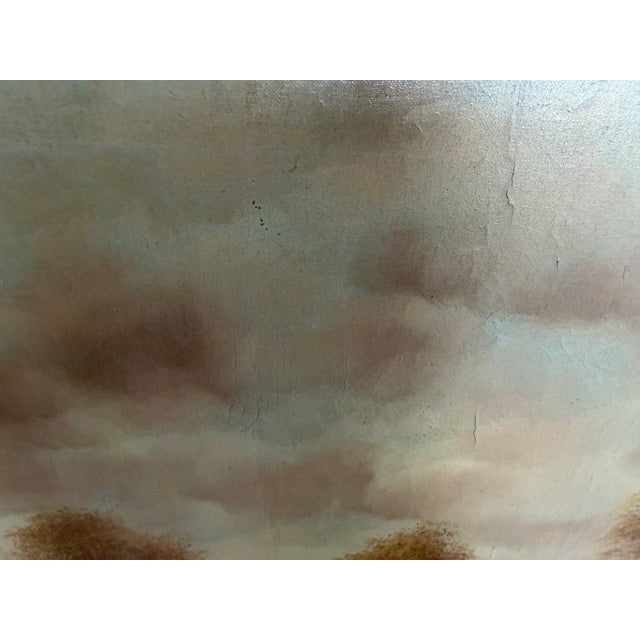 This beautiful antique oil on canvas depicts a peaceful woodland landscape bathed in soft, atmospheric light. A winding...