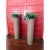This pair of vintage 1960s planters features a cylinder-shaped design with woven exteriors, embodying the natural textures...