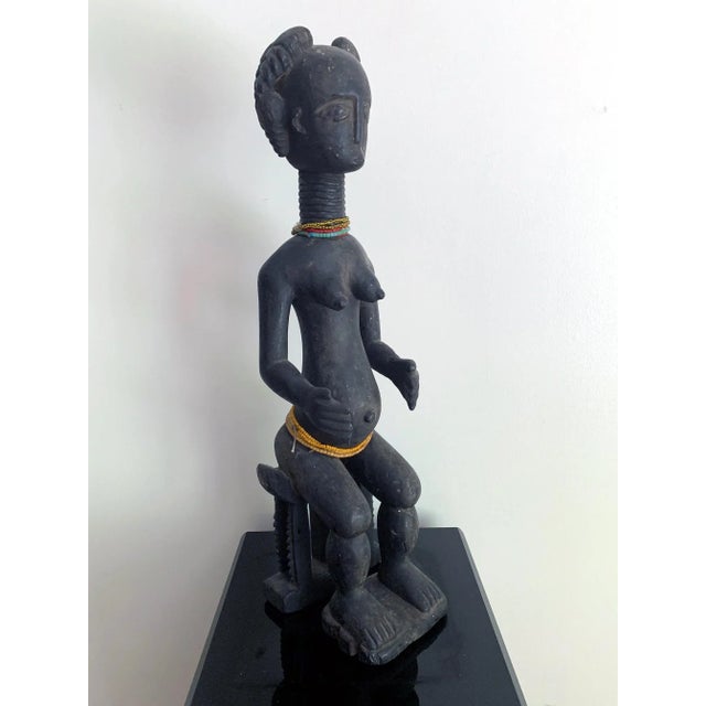 On offer is an Ashanti female fertility figure from Ghana, West Africa, circa Mid-20th century. Carved from a single block...