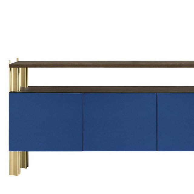 Defined by Robert Stadler's Flexor system, this sideboard combines blue polished-lacquered wood panels with a structured...