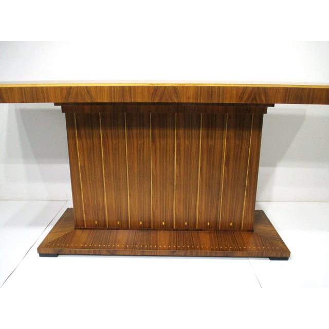A very well crafted exceptionally stunning flamed grain mahogany bar with lighter inlayed wood details in the manner of...