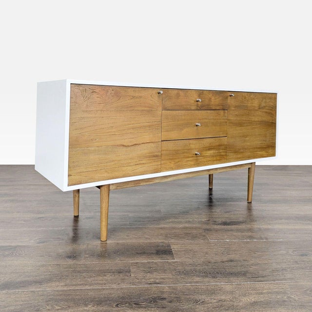 Wood and laminate 3 drawer, 2 cabinet sideboard with adjustable shelves. Brand: Scandinavian Designs. Dimensions (in): 64W...