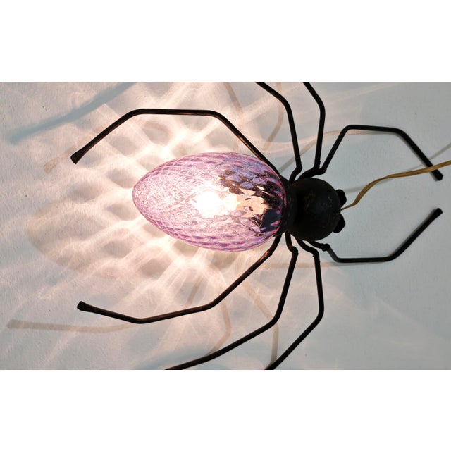 This famous vintage spider-shaped wall lamp is a piece of Italian craftsmanship, dating primarily to the 1950s and 1960s....
