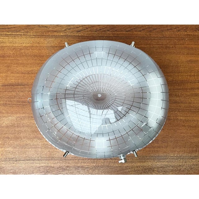 Imposing pendant lamp from the italian manufacturer iguzzini according to a design by the architect paul andreu. the...