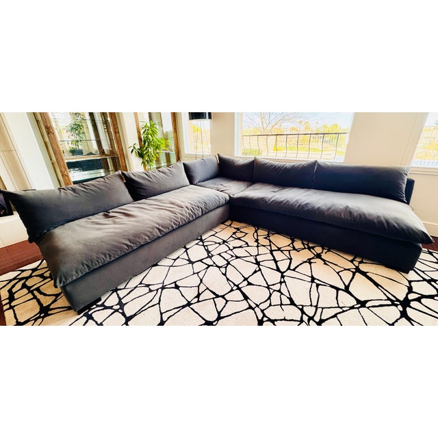 Designer charcoal sectional purchased new 2 years ago and kept in excellent, like-new condition. High-quality, well-...