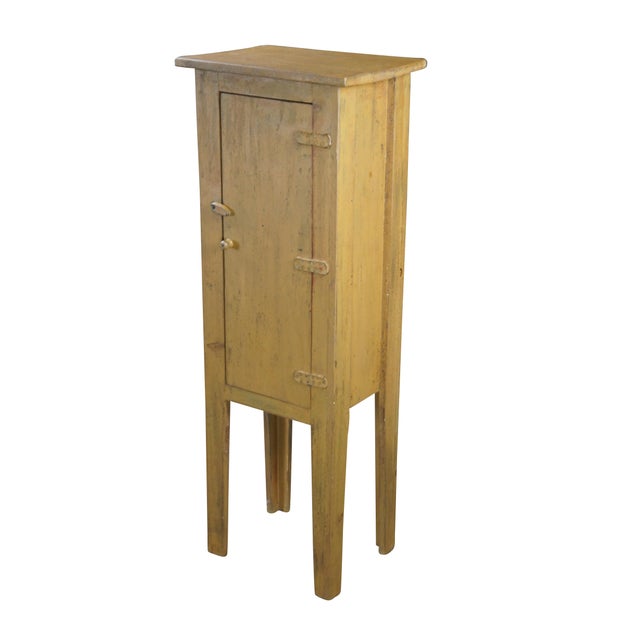 A neat rustic linen cabinet. Made from Pine with a painted finish. Features 2 fixed interior shelves, leather hinges and a...