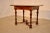 19th century French table made from walnut. The top is beautifully detailed with cross banding around the edges in a...