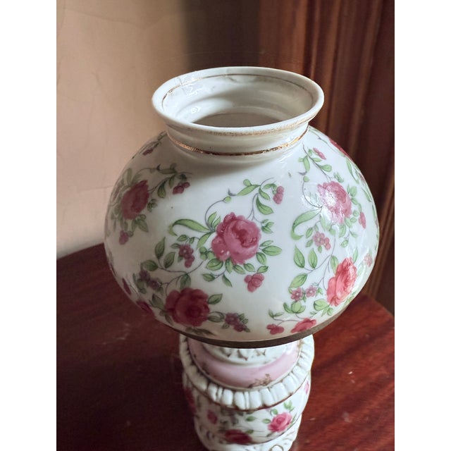 Mid century miniature “Gone with the Wind” style oil lamp with milk glass construction. Opaque white glass with hand-...