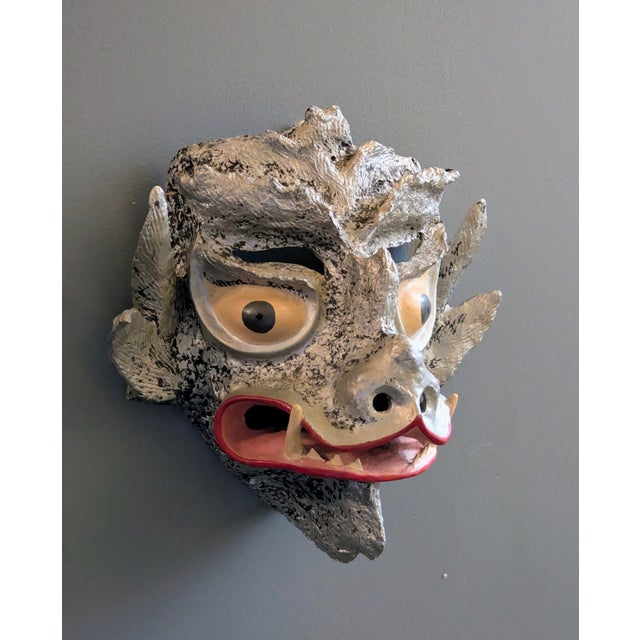 Traveling Man Treasures is selling this unique vintage Chinese paper-maché folk art festive mask fashioned as a dragon or...