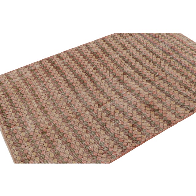 Hand-knotted in wool, this 4×6 vintage runner originates from Turkey, circa 1960-1970, and is believed to be among the...