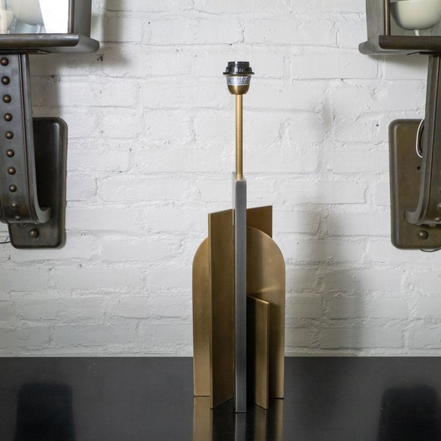Single Bauhaus inspired skyscraper table lamp composed of brushed brass and treated metal panels. Studio piece of unknown...
