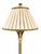 Elegant pair of Hollywood Regency tall table/buffet lamps featuring intricately carved bases with a silvered finish. The...