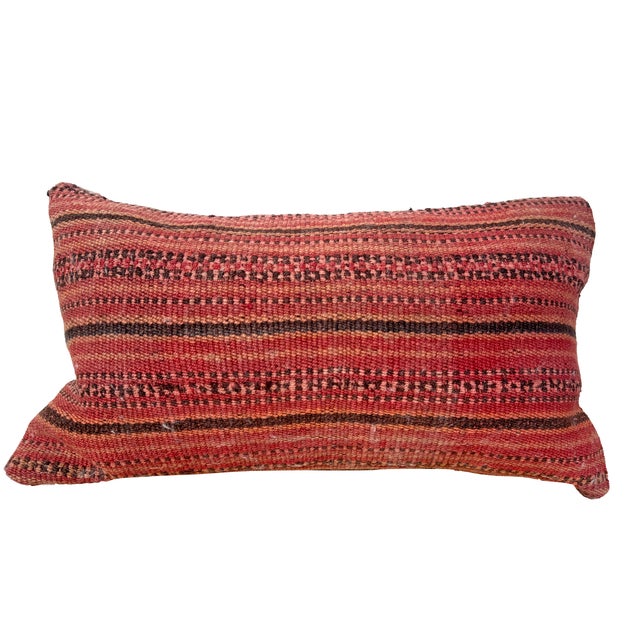 A pair of vintage kilim lumbar pillows with warm, time-softened color and beautiful woven texture. The front panels...