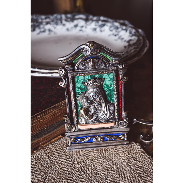 A magnificent antique Italian silver religious icon featuring an exquisitely detailed Madonna and Child in high relief...