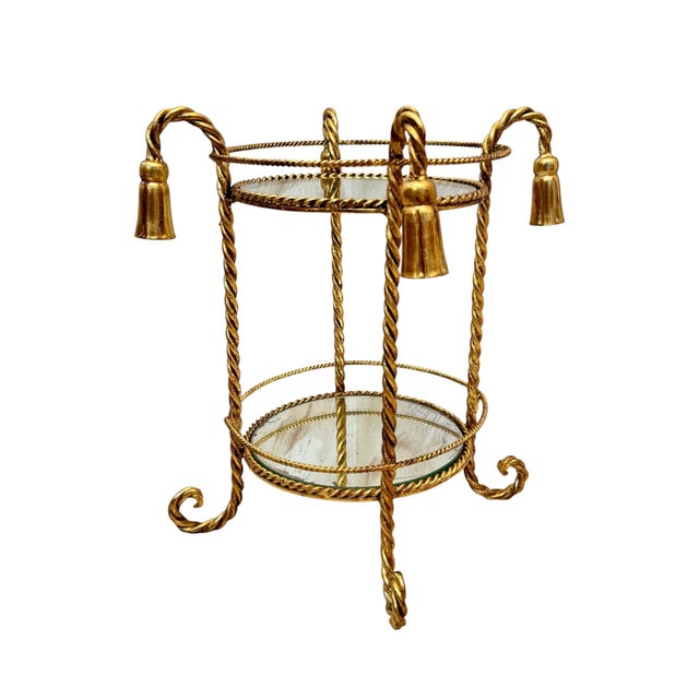 Vintage Hollywood Regency gilt metal table, Italy 1970s. Gold plated metal construction decorated in rope formed legs and...