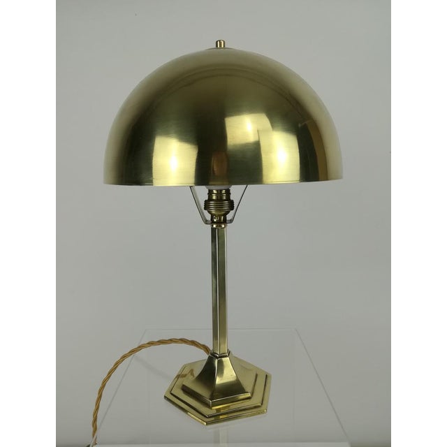 Solid brass, mirror polished table lamp from the 1920s Total height: 32 cm Diameter of the shade: 20 cm Diameter of the...