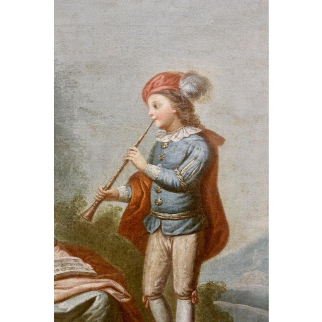 Important Trumeau in the Louis XVI style, consisting of a mirror and a painting of musicians in the XVIIIth century style,...