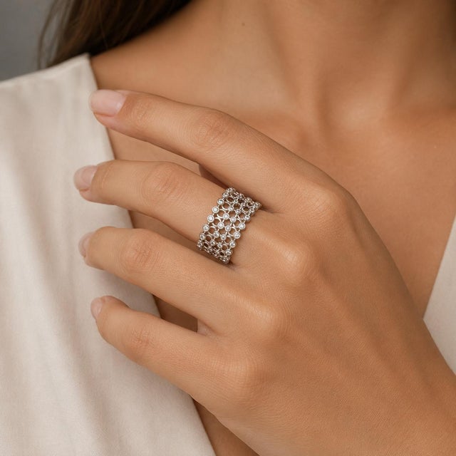 14k White Gold expandable band ring with 1.20 carats of round white diamonds. 12.58g, Expands form size 7 to any larger size.