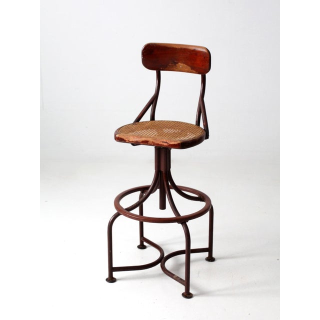 This is a Western Electric telephone operator's chair circa 1930. The magnificent wood and metal stool features an...