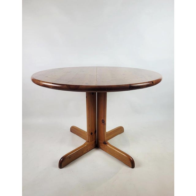 An icon of Danish design in the style of Rainer Daumiller's designs, this round pine table from the 1970s is presented. We...